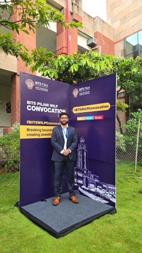 Abhijith standing in podium